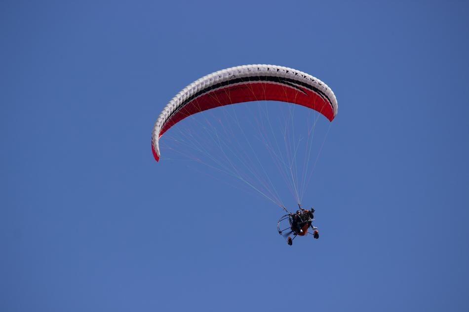 paraglider in the sky in the colors of the Russian flag