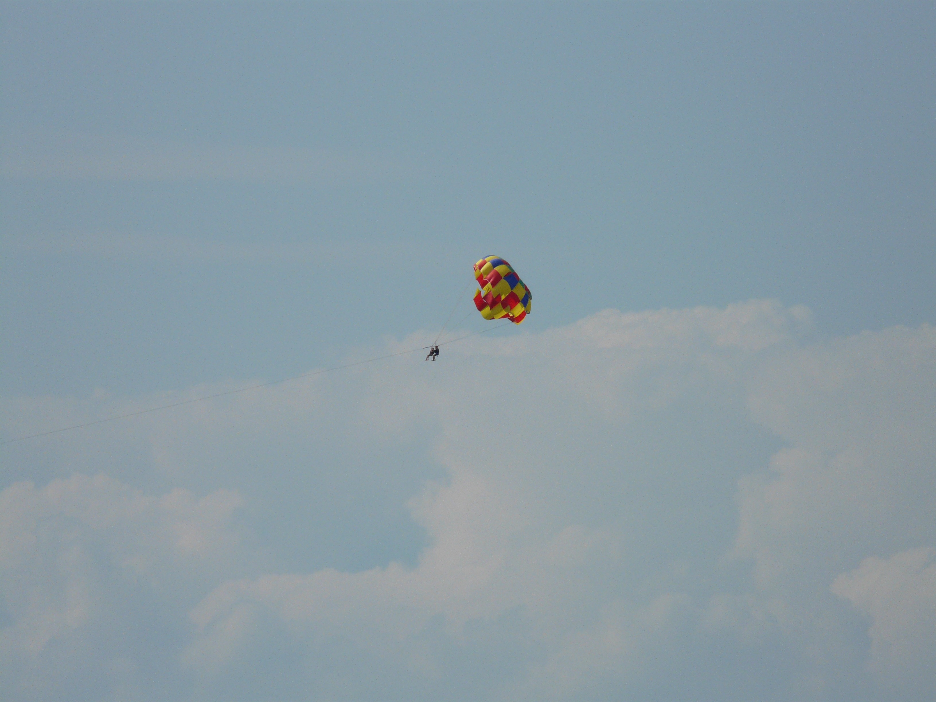 Parachutist flying in the sky with clouds free image download