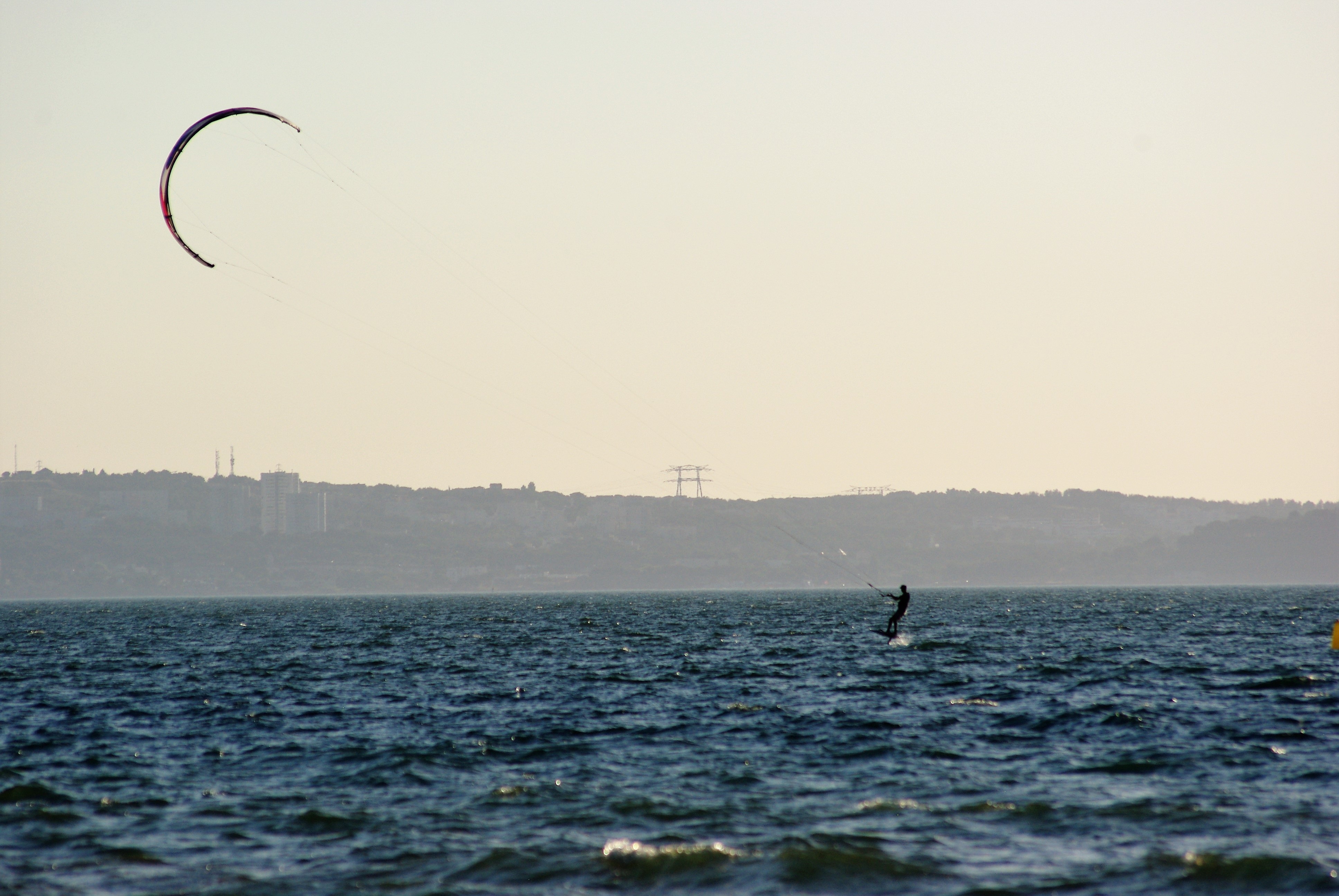 Kitesurfing off the coast of France free image download