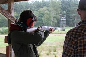 People, shooting with the rifle, on the shooting range