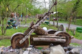 wooden motorcycle as a sculpture in the park