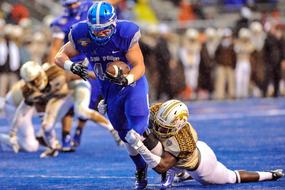the struggle on the field of American football players in college
