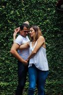 Couple, dancing near the beautiful green plants