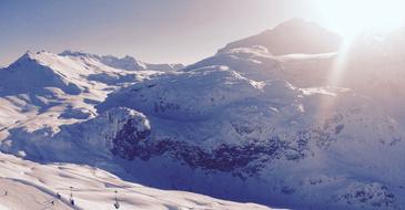 people on the top of the mountain in winter