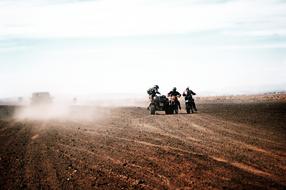 People on the motorcycles, on the motocross competition, in the beautiful desert in Morocco, Africa