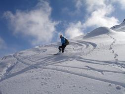 skateboarder with a backpack on the slope