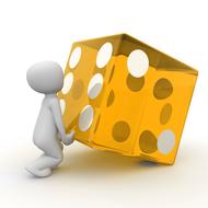 White figure, lifting yellow dice, on the white surface, on clipart