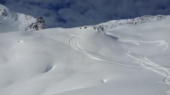 ski trails in the mountains on a sunny day