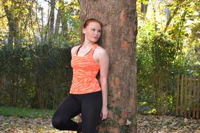 sports girl in autumn park