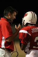 Football Coach with player close-up
