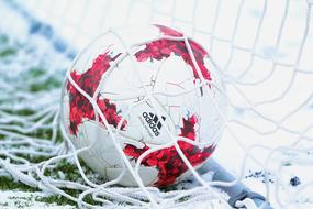 soccer ball in white net close up