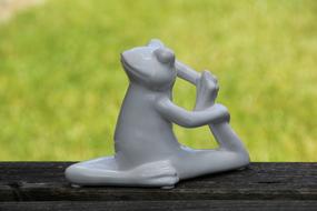 white porcelain yoga frog figurine