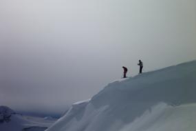 photo of two skiers on a snowy slope in Canada