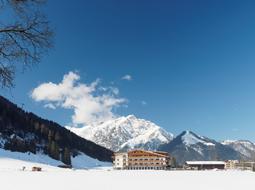 Buildings on the beautiful, snowy Tyrol Alps in Pertisau, Austria