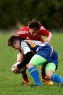duel in rugby on the field on a blurred background
