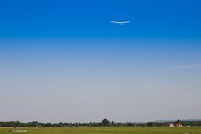 free flight of a glider in the blue sky