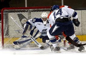 Colorful player and goalie, playing ice hockey on the competition