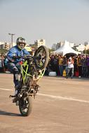 stunt on a motorcycle during a performance