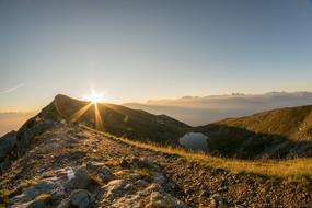 sunlight on the horizon of the hill