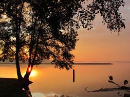 orange sunset over calm water