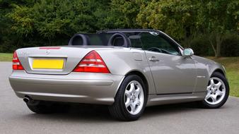 Car Mercedes Slk on the road in the countryside