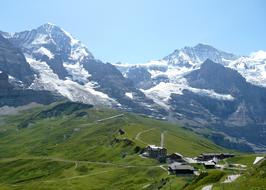 Beautiful green and snowy Alpine mountains and Wengen, Switzerland