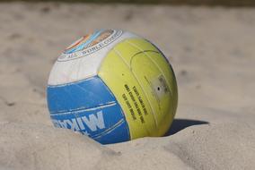 volleyball ball on the sand on the beach close up