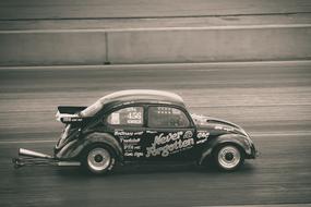 monochrome photo of Automobile Fast Panning