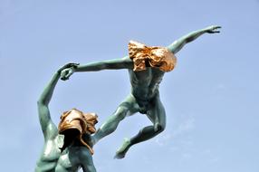 Beautiful statue of the gymnasts, by Anna Chromy, in Saint-Tropez, France, at blue sky on background