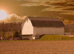 landscape of Rustic Barns at sunset