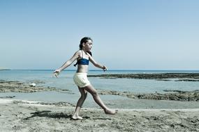 Girl Dancing on Beach