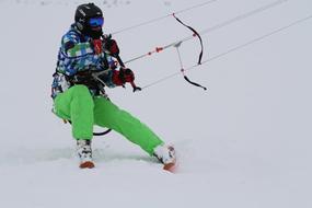 Snow Kite, person on snowboard holds bar