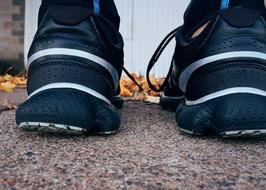 black runner sneakers, close-up