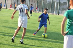 people playing football on the field