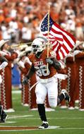 athlete with american flag at the stadium on a blurred background