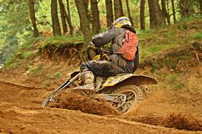 Motocross Enduro in the sand in the forest