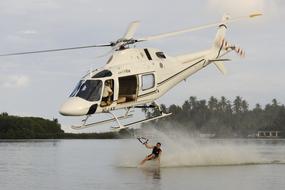 helicopter with a man on the water
