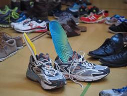 photo of shoes in a sports locker room