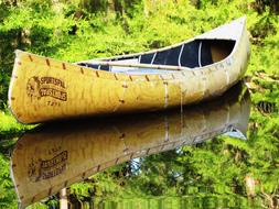 canoe reflected in mirror water