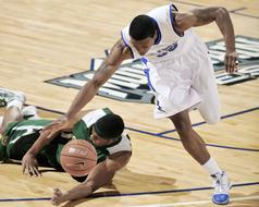 wrestling for the ball on the basketball court