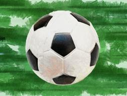 white soccer ball on green boards background