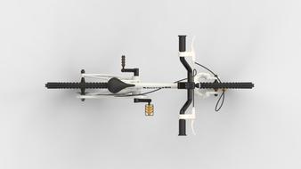 Top view of the white and black bike on the white surface