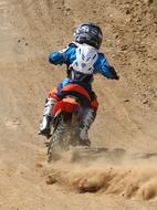 Motocross driver on Dirt Dust
