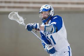 lacrosse player in blue white uniform