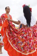 Couple dancing carimbo, in beautiful and colorful brazilwood clothing