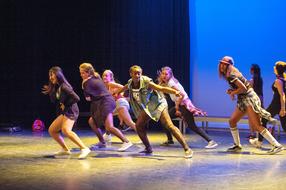 Girls, doing hiphop dance, on the stage, in lights