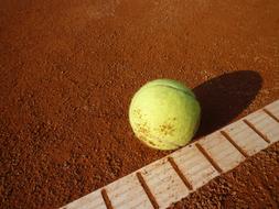 Yellow ball on Tennis Court