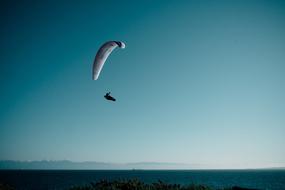 Paragliding Flying over ocean