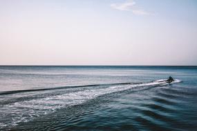 Person on the jet ski, on the beautiful ocean with turquoise water