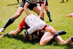 Men players on the green field, on the competition